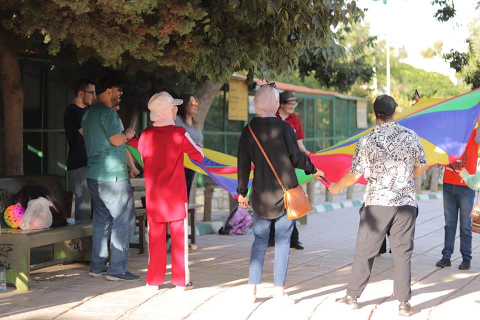 A community-engagement activity in an outdoor park.